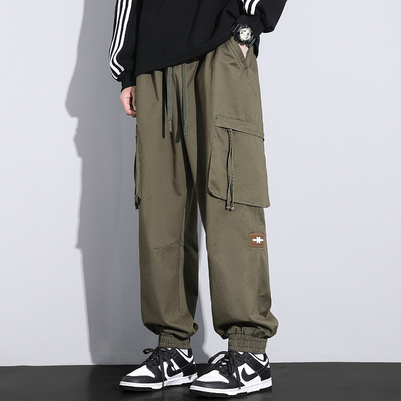 Nuevos pantalones de trabajo de alta calidad de primavera para hombres, moda multibolsillos con tendencia universal