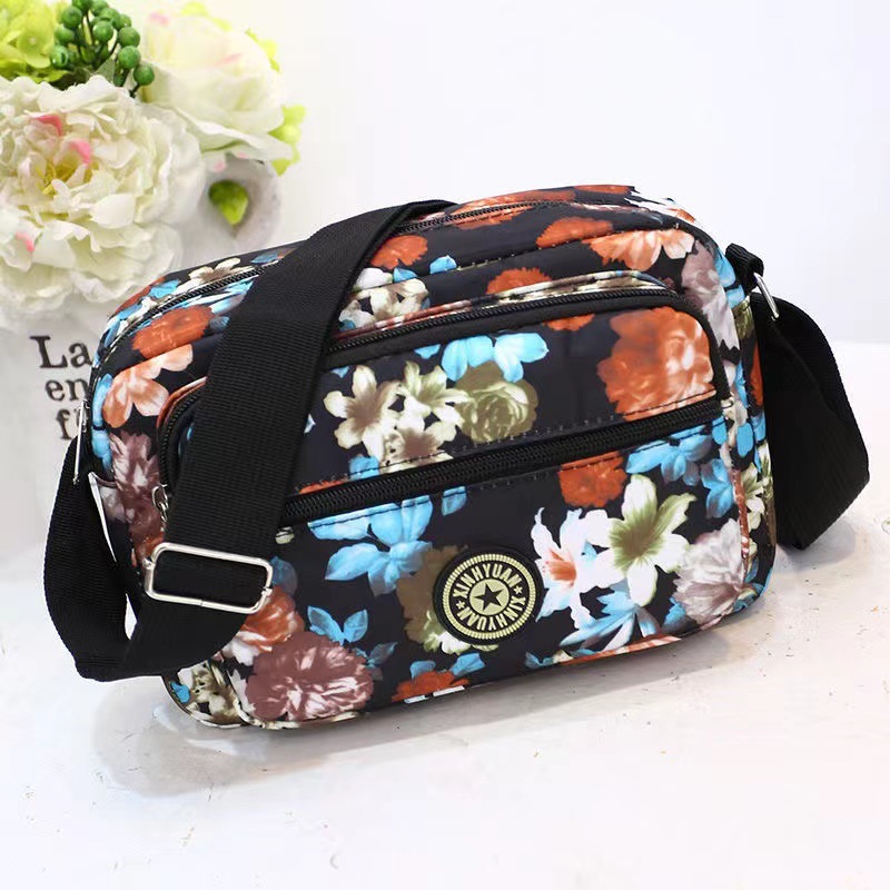 Bolsa de tela de flores bolsa de mensajero de las mujeres nueva bolsa de Madre de gran capacidad bolsa de hombro individual de mediana edad y ancianos bolsa de tela Oxford bolsa