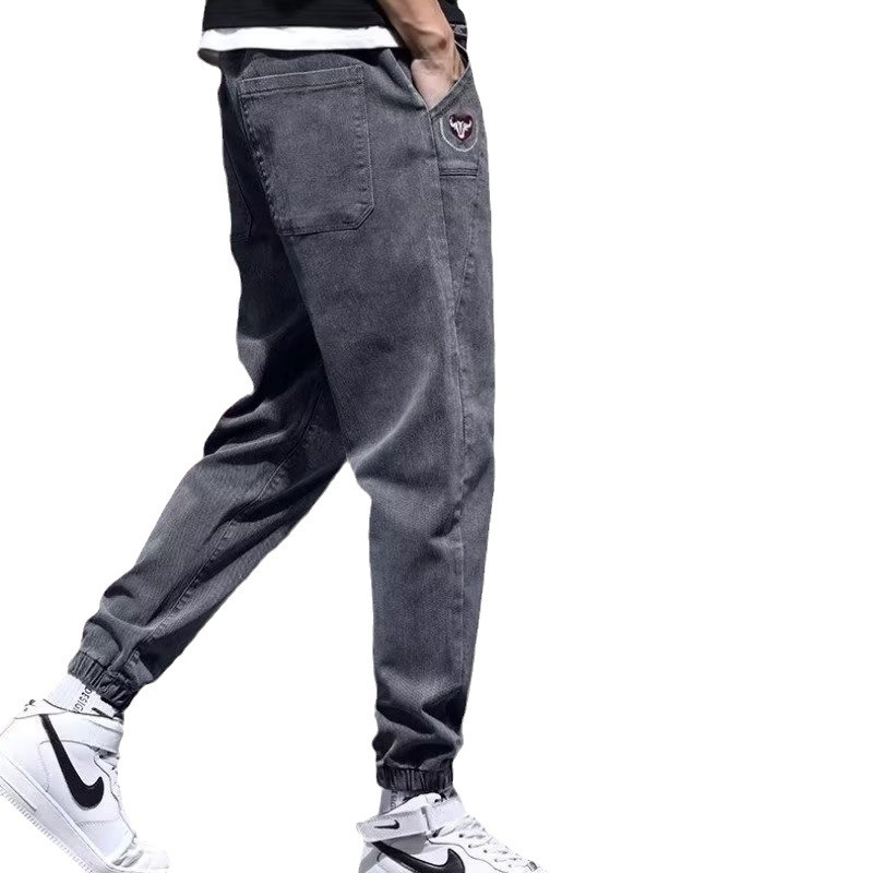 Otoño marca de moda Harlan jeans pantalones de pies pequeños de estilo coreano para hombres pantalones elásticos sueltos de otoño e invierno con cintura elástica para hombres