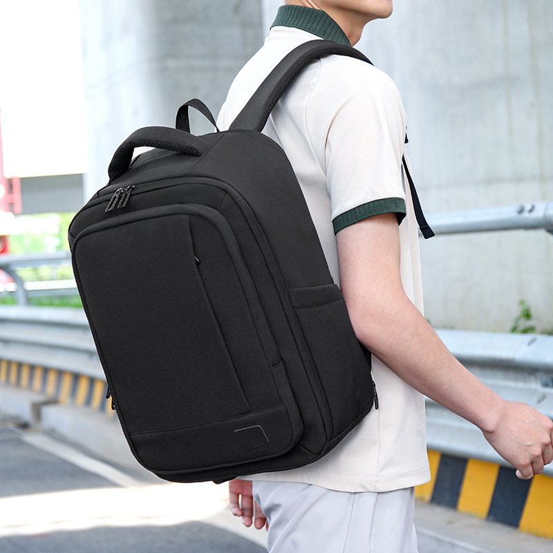 Comercio exterior al por mayor expandible color sólido mochila de gran capacidad de viaje de negocios bolsa de computadora colgar tracción bolsa de viaje