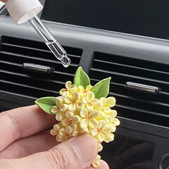 車のアロマモクセイの自動車の噴出口の香水の装飾は味の拡香器の花の香りの雰囲気の置物を取り除きます。