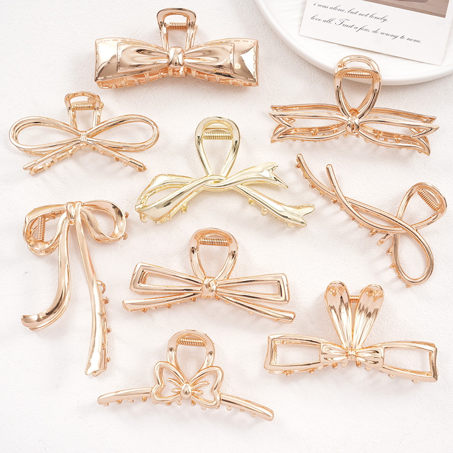 IG Style Shiny Women's Bow Knot Zinc Alloy Imitation Pearl Rhinestone Hair Claws display picture 6