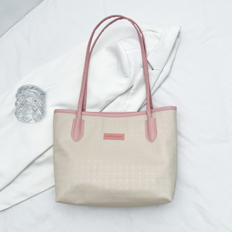 Bolsa de gran capacidad para mujeres 2024 nueva bolsa de hombro de trabajo casual, sensación avanzada de estudiantes universitarios en clase, bolsa de viaje