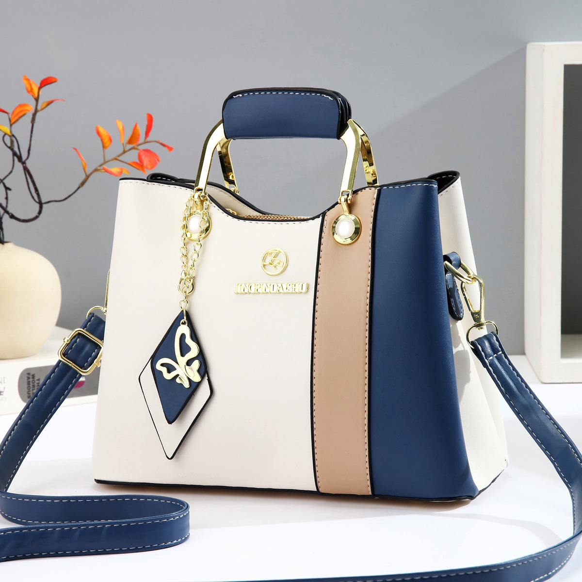 2025 nuevo bolso de mujer de mediana edad de color en contraste bolso de axila casual de todo fósforo bolso de madre de temperamento bolso de mensajero portátil de un solo hombro