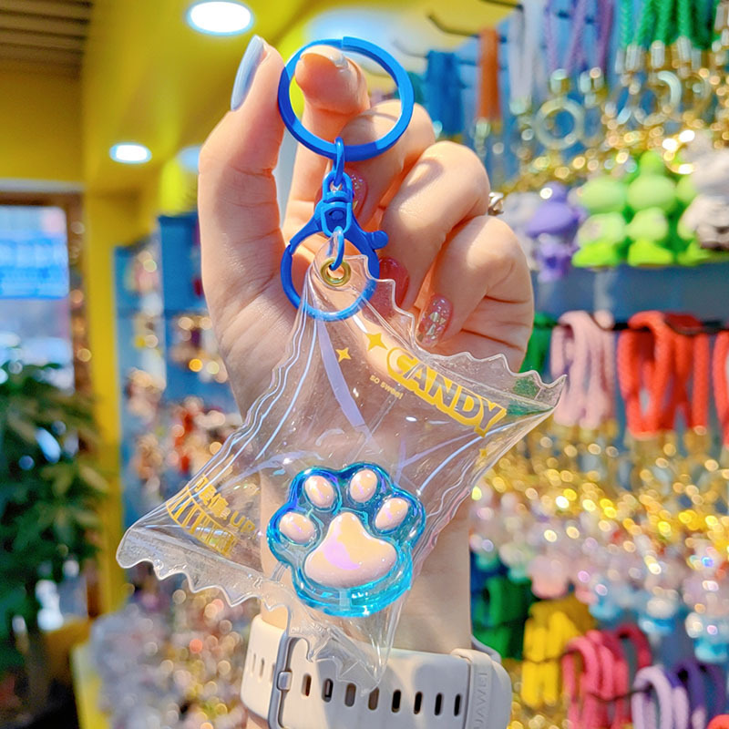 Caramelos de color translucentes llaves de garra de gato bolsos de automóviles llaves colgantes delicados colgantes de garra de gato llaves al por mayor