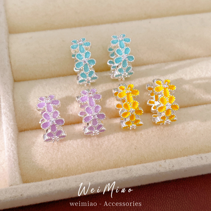 Dopamina color zircón goteo flor aretes redondos frescos aretes dulces lujosos alta sensación auriculares al por mayor