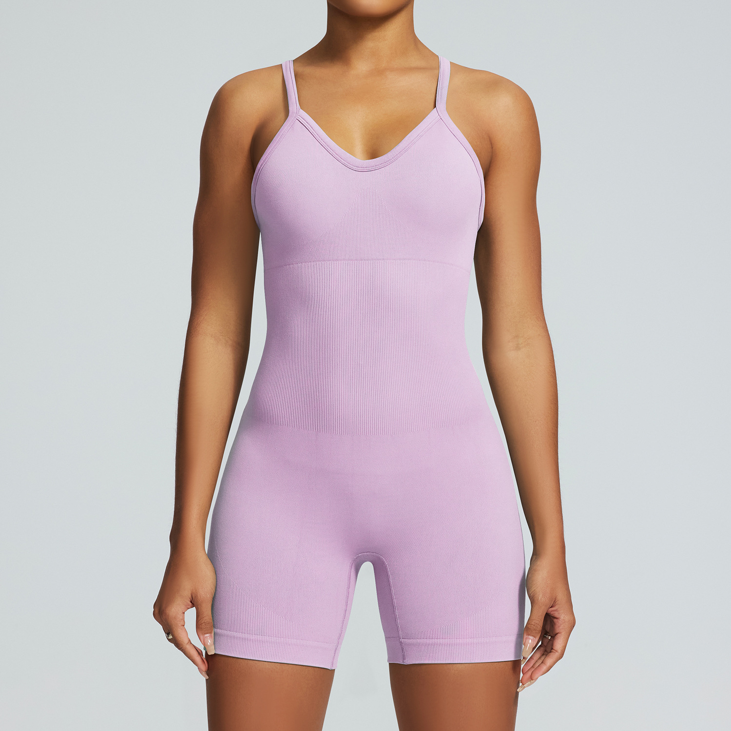 Ropa de yoga de una pieza sin costuras transfronterizas europeas y americanas para mujeres, monos deportivos y de fitness, monos con tirantes de elevación de cadera de alta elasticidad para mujeres