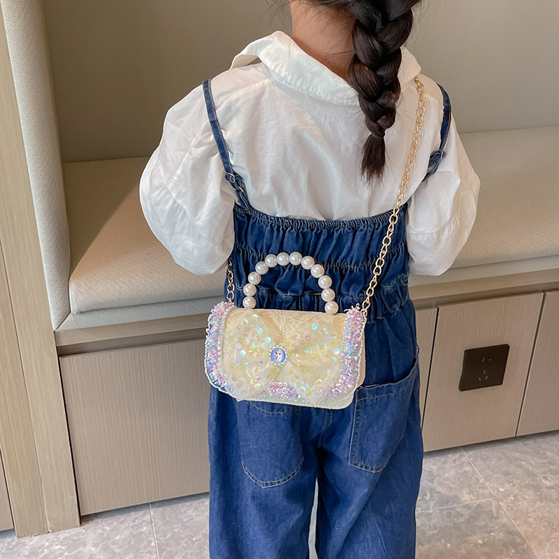 Primavera y verano nueva celebridad en línea bolso de los niños moda Chanel estilo princesa bolsa pequeña niña linda bolsa de mensajero portátil al por mayor