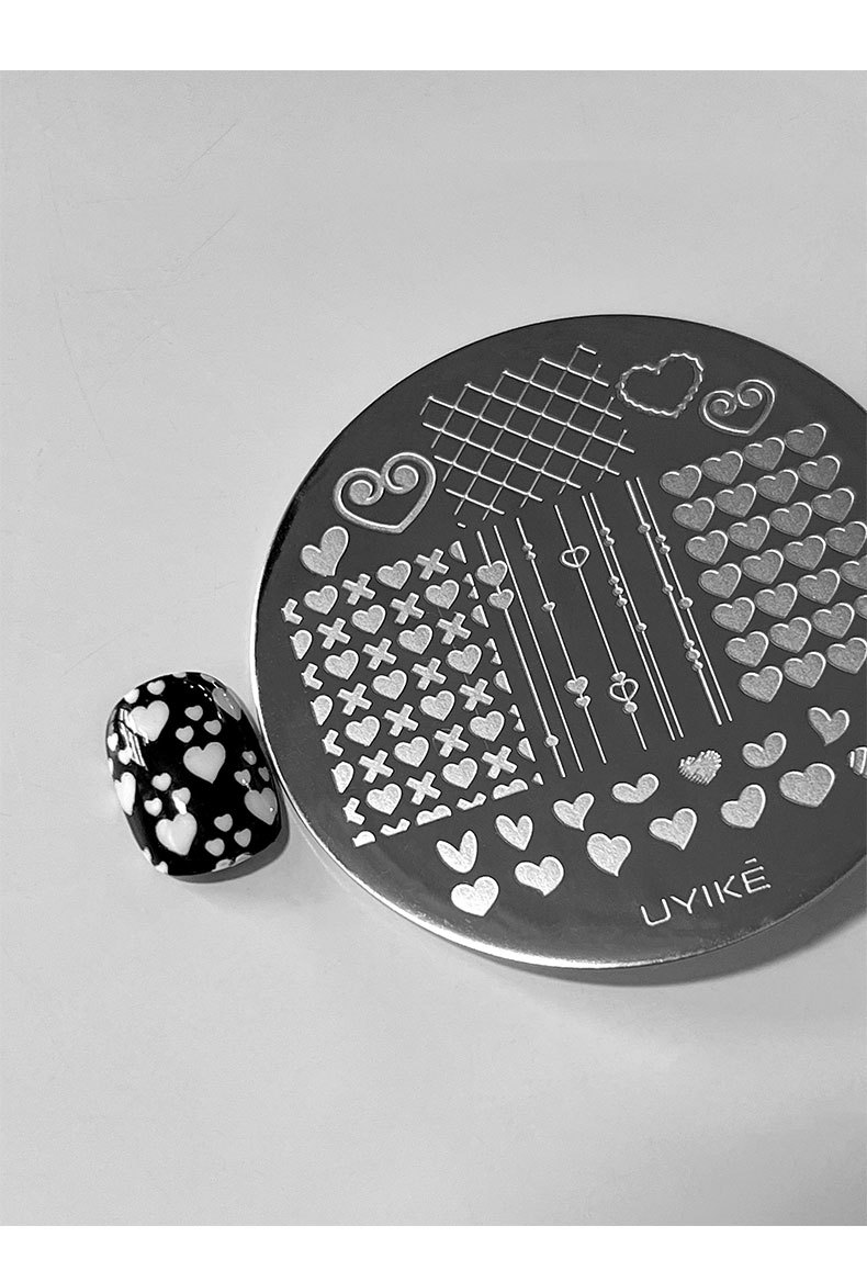 New 12-piece nail art steel plate set with leopard print, plaid, lace, and bow print transfer templates and tools wholesale