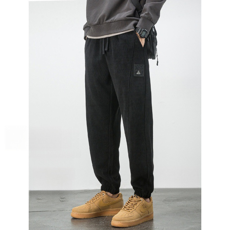 Korean-style autumn and winter black sweatpants for men, loose fit with cuffed ankles, plus size, slimming, casual sports pants, trendy and versatile