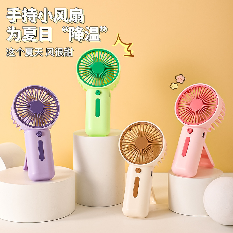 2025 cross-border new handheld mini electric fan usb rechargeable macaron 7 battery small fan portable