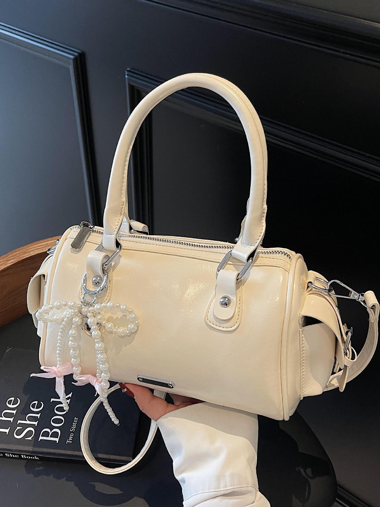 Versión coreana del bolso pequeño de mano súper caliente para mujer 2025 nuevo bolso de hombro de diseño de nicho bolso de mensajero popular de verano