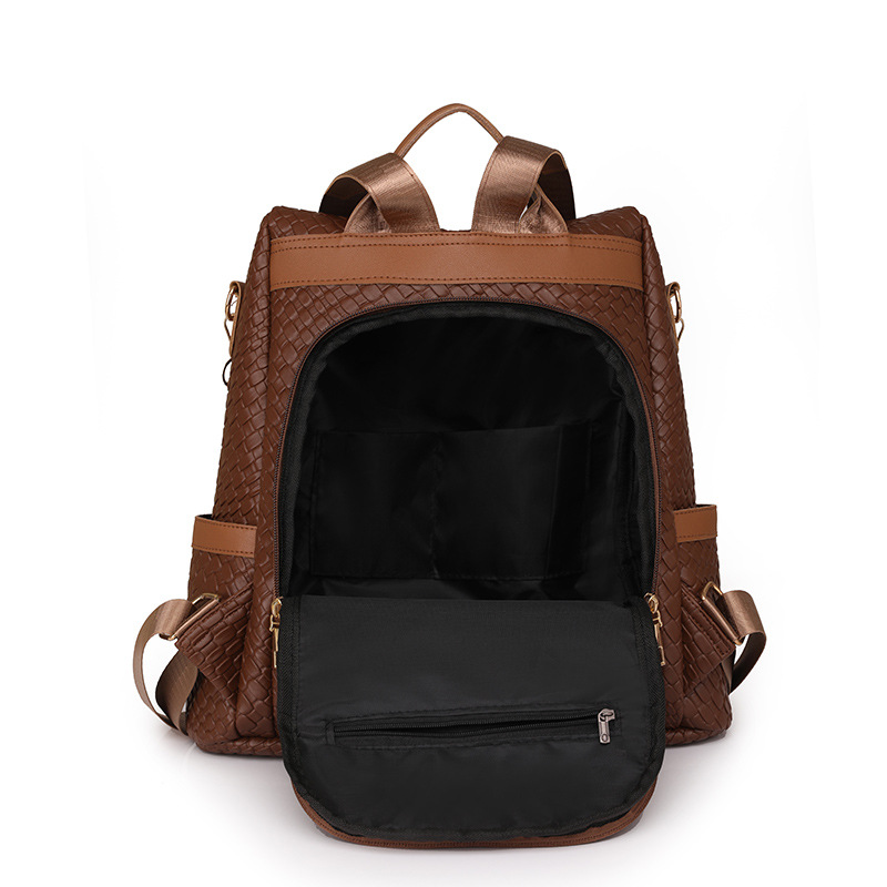 Comercio exterior al por mayor 2024 nuevas señoras casuales mochila antirrobo moda borla tejida mochila de viaje de doble uso marea