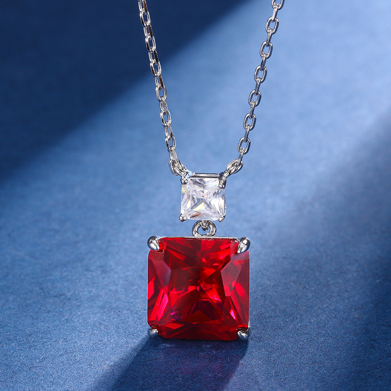 Zhuang Sheng joyería cobre inferior chapado en oro simulación paloma rojo sangre corindón verde nano nicho temperamento traje piedra principal 12*12