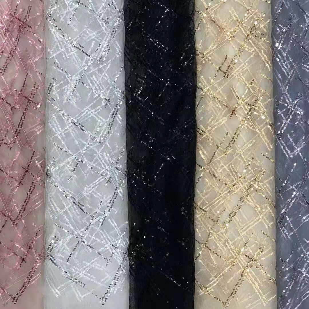 热卖款无弹锦加强网底布交叉对色绣片 小闪亮裙装等面料 现货供应