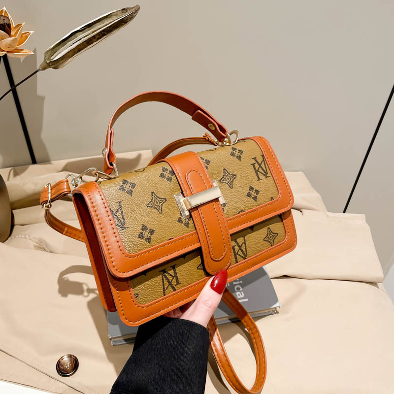 Vintage empalme este año popular bolso de mano para mujeres 2025 nueva moda impresión de letras de hombro mochila de moda