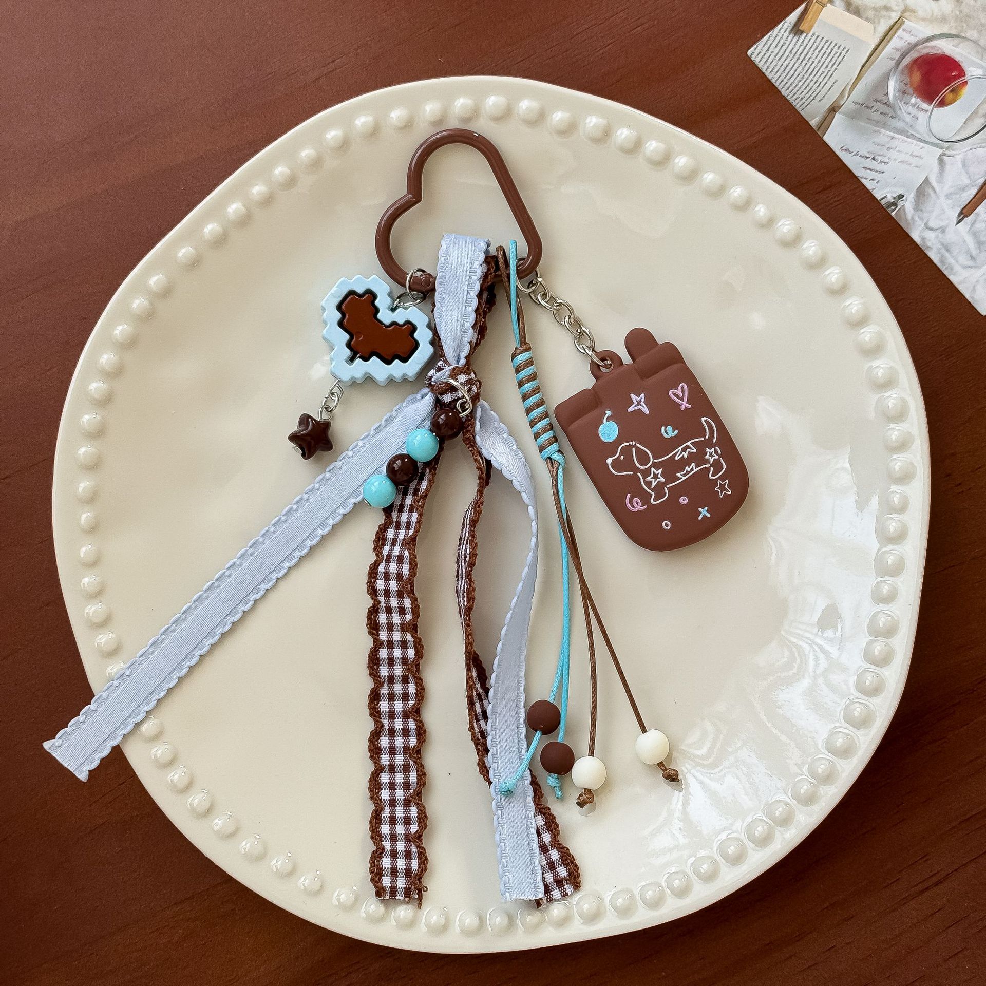 Korean-style cute dachshund dog keychain with milk coffee plaid ribbon and tassel pendant, cartoon versatile bag accessory wholesale