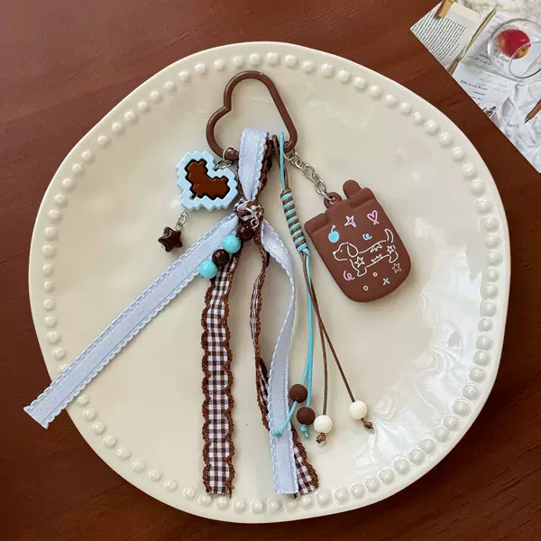 Korean-style cute dachshund dog keychain with milk coffee plaid ribbon and tassel pendant, cartoon versatile bag accessory wholesale