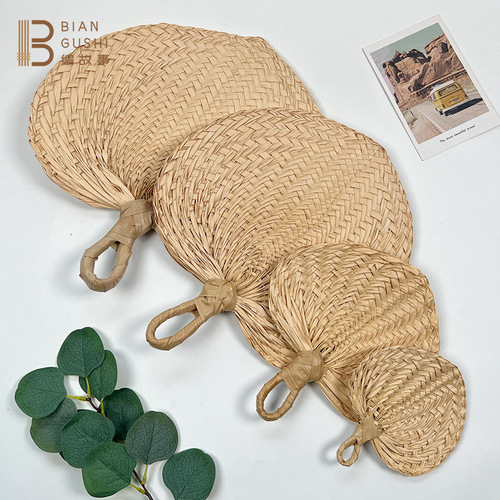 Rustic-style natural palm-leaf woven fan for summer cooling and mosquito repellent—large, handcrafted, and perfect for a gentle breeze.