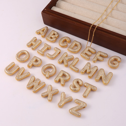 Hot-selling gold-plated copper bracelet with zirconia balloon bubble pendant, featuring 26 English letters.