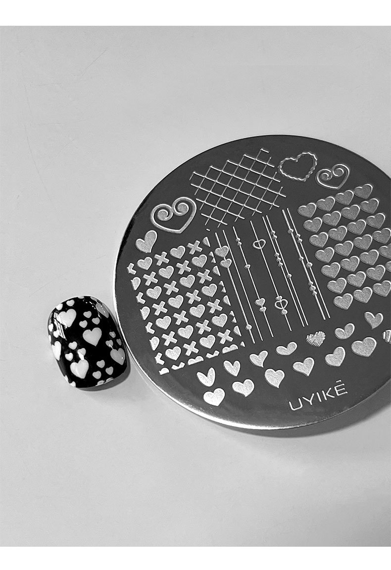 New 12-piece nail art steel plate set with leopard print, plaid, lace, and bow print transfer templates and tools wholesale