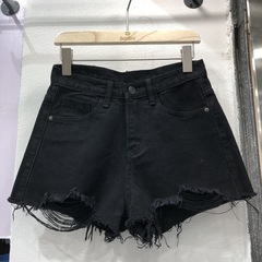 春夏のハイウエストのデニムのショートパンツの女子学生の新型の穴が開いています。