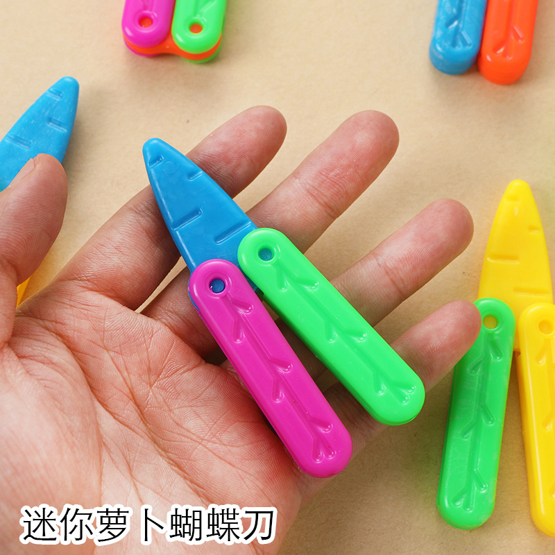 Mini mariposa cuchillo de rábano cuchillo de descompresión cuchillo de rábano que emite luz lindo bebé juguete internet celebridad plegable mariposa cuchillo