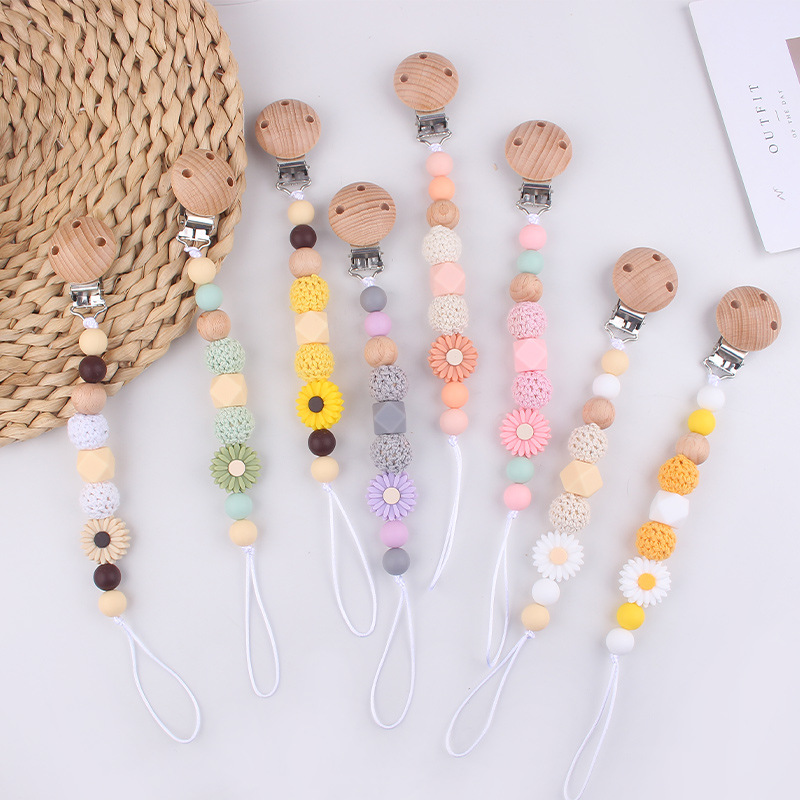 Productos para bebés Clip de chupete de haya Dibujos animados de bebé creativo pequeña margarita pequeña mordedor molar cadena de chupete anti-caída