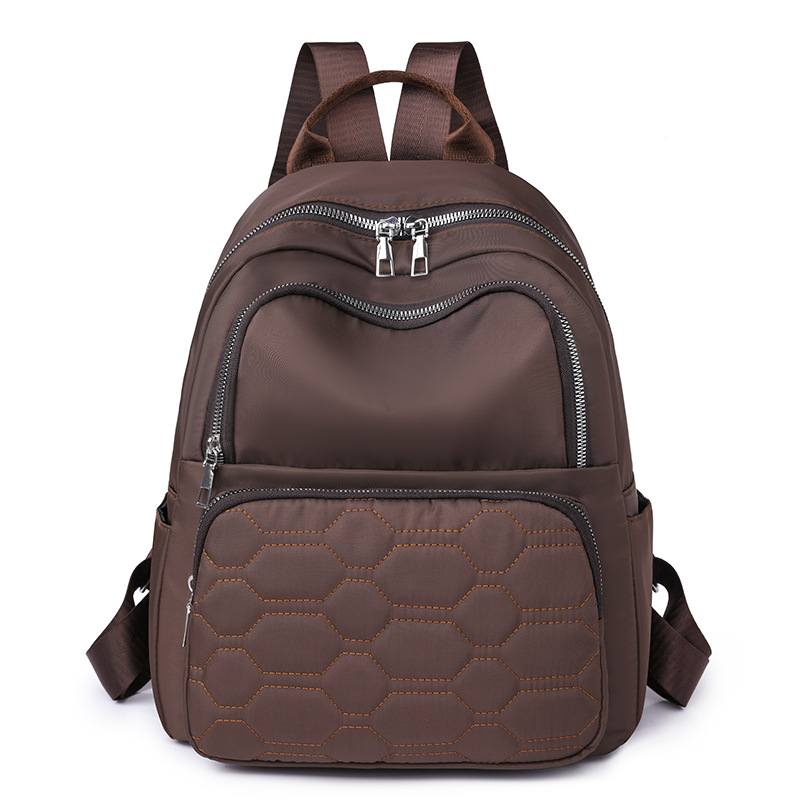 Fábrica al por mayor 2023 nueva mochila de nailon casual para mujer, línea de bordado de moda, mochila de viaje de gran capacidad, mochila escolar