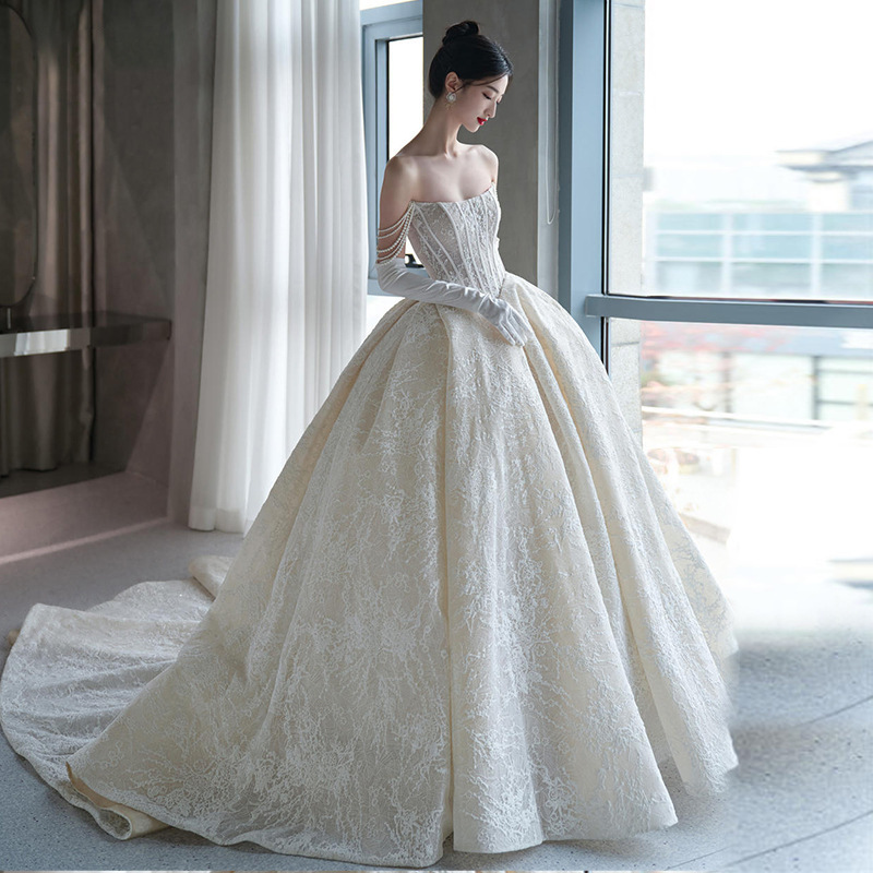 Vestido de novia sin tirantes, nuevo estilo 2026, estilo francés forestal, ligero, con textura vintage, adecuado para figuras pequeñas y de talla grande, con cola.