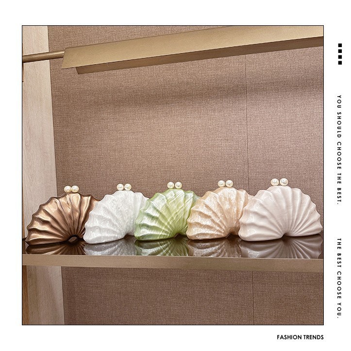 Europa y los Estados Unidos nuevos paquetes de cena de damas de hombro único en forma de concha acrílica de mano de lujo ligero paquete de moda de noche