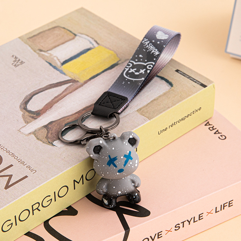 Creativo, colorido, violento, muñeca de oso de dragón, método de lucha de perros, llavero de muñeca de moda, llavero de personalidad de coche