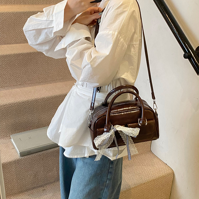 Bolso de Boston portátil casual transfronterizo para mujer 2025 nuevo bolso de mensajero de hombro con lazo simple y versátil coreano