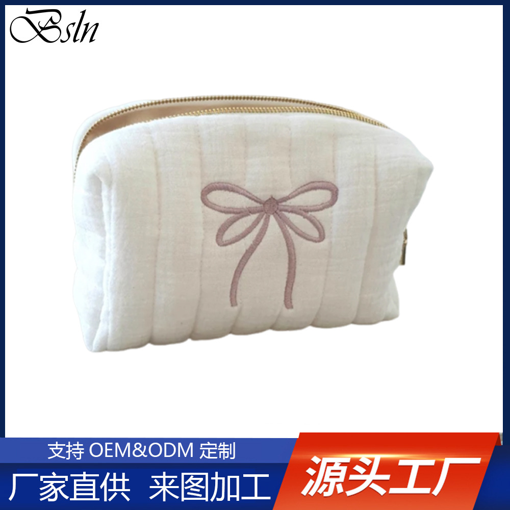 Fashionable cosmetic bag with bow