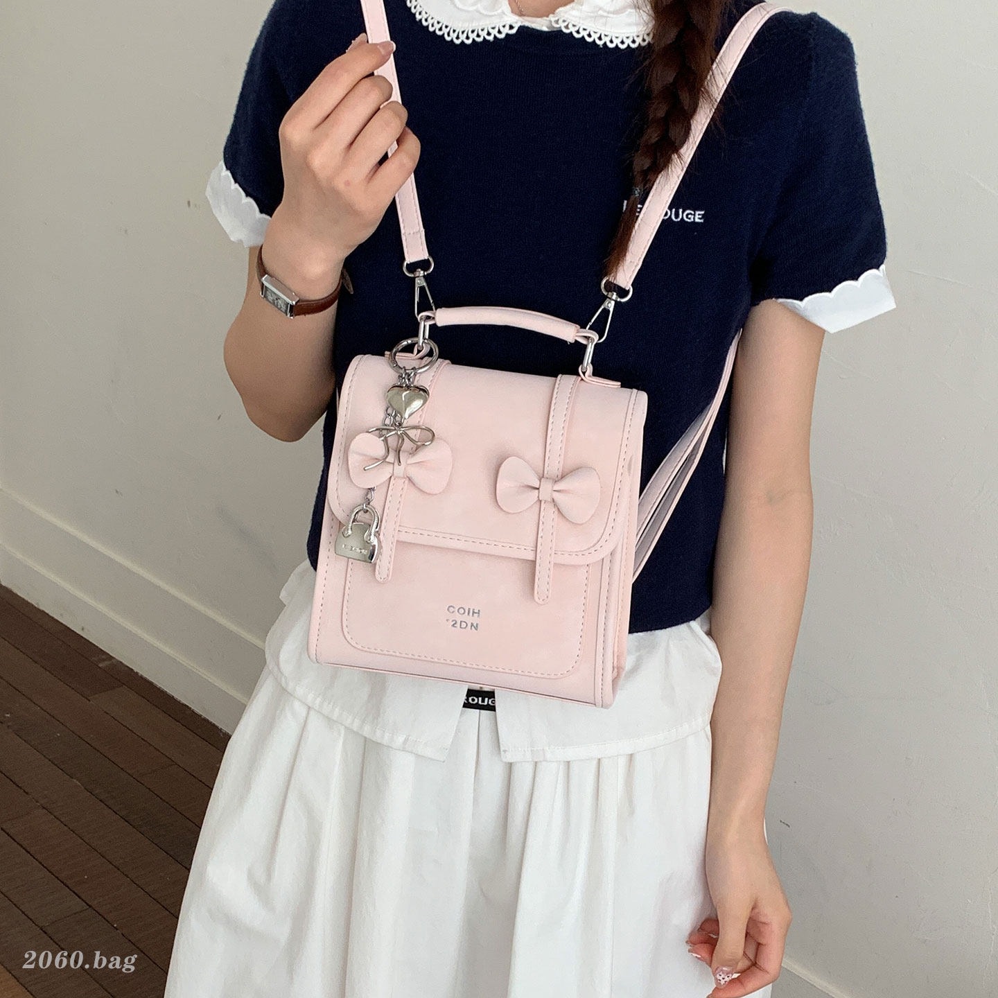 Mochila de temperamento de viaje femenino 2026 de alto valor de cara simple coreana mochila de viaje nuevo arco bolso pequeño