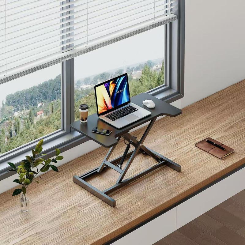 立っているデスクの昇降コンピュータの机の折り畳みの机の上で気動のタイプのデスクトップはノートの小さいテーブルを高く上げます。|undefined