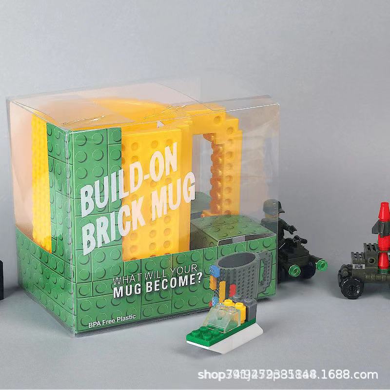 Fábrica al por mayor personalizado creativo Asamblea taza de agua educativa taza de té resistente a la gota taza de té Lego bloque de construcción
