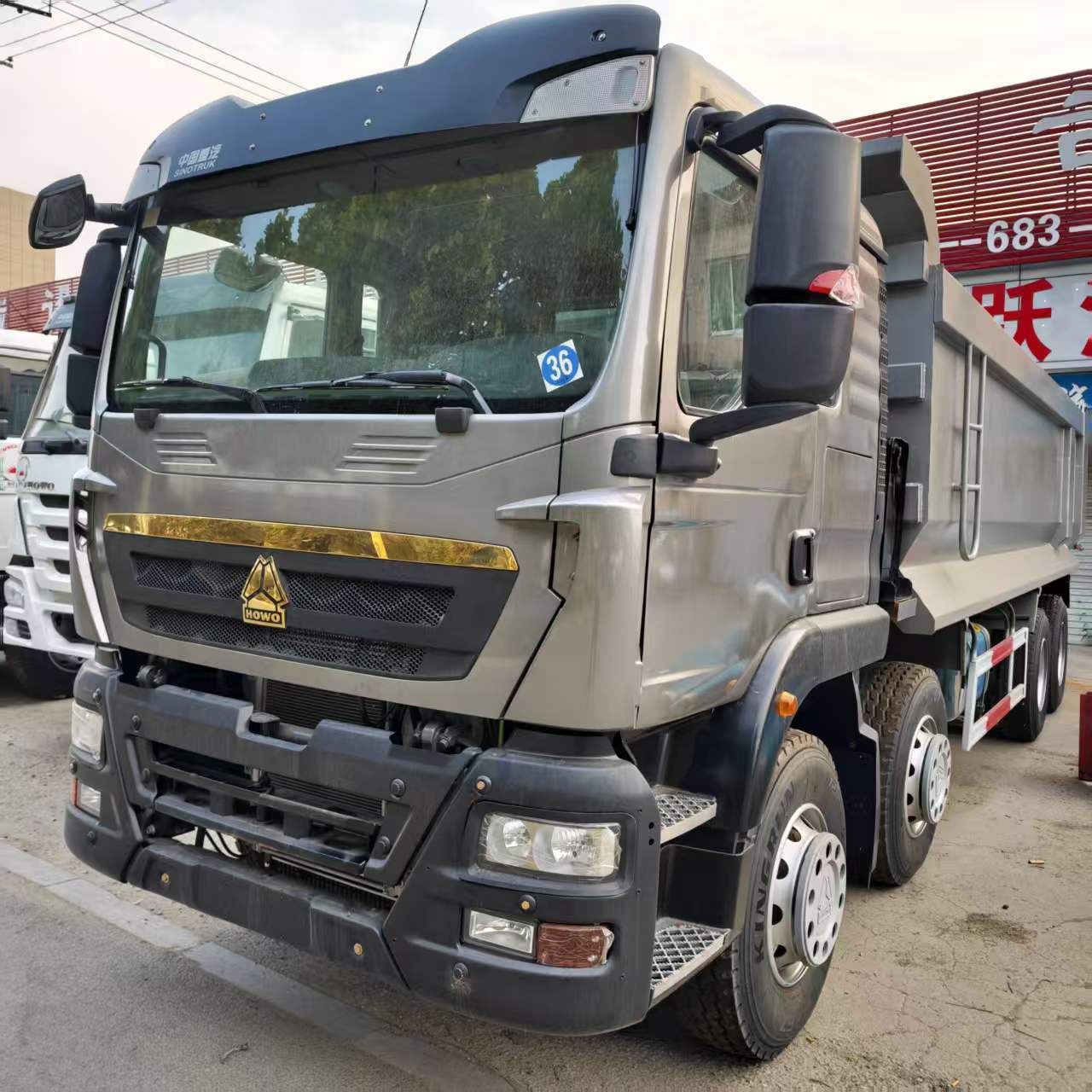Current Stock for Export: Howo Dump Truck 8X4 Earthmoving Transport Tipper Truck, Heavy-Duty Dump Truck, Earthmoving Truck Parts