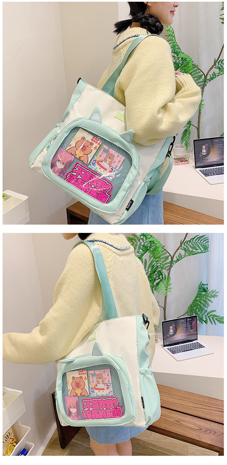 The new cute cartoon printed student bag with a large capacity and transparent student storage single-shoulder bag is selling well for women undefined