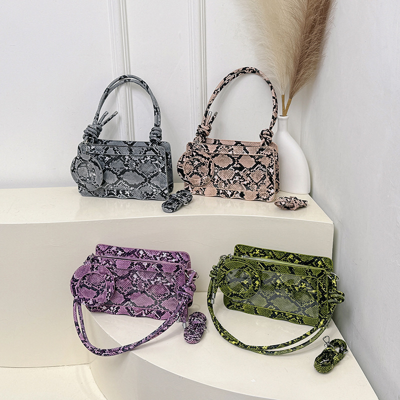 Serpiente de aire extranjero textura simple primavera 2025 nuevo temperamento diseño de moda mochila de hombro elegante bolso cuadrado