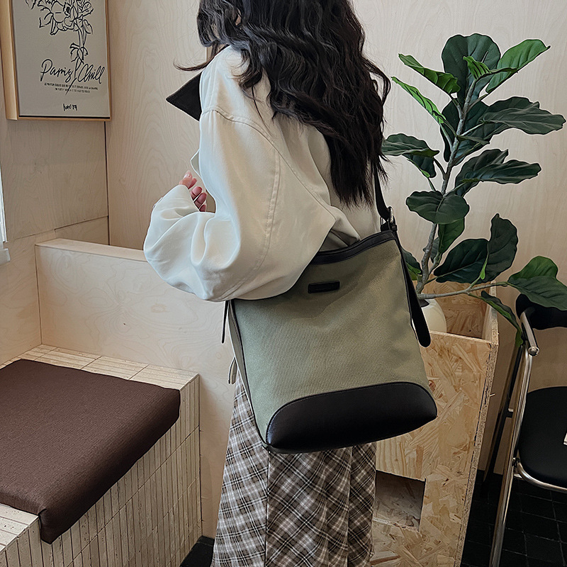 Transfronterizos de gran capacidad bolso de balde de mujer bolso versátil otoño / invierno 2025 nuevo tipo de mochila de hombro casual bolso de transporte