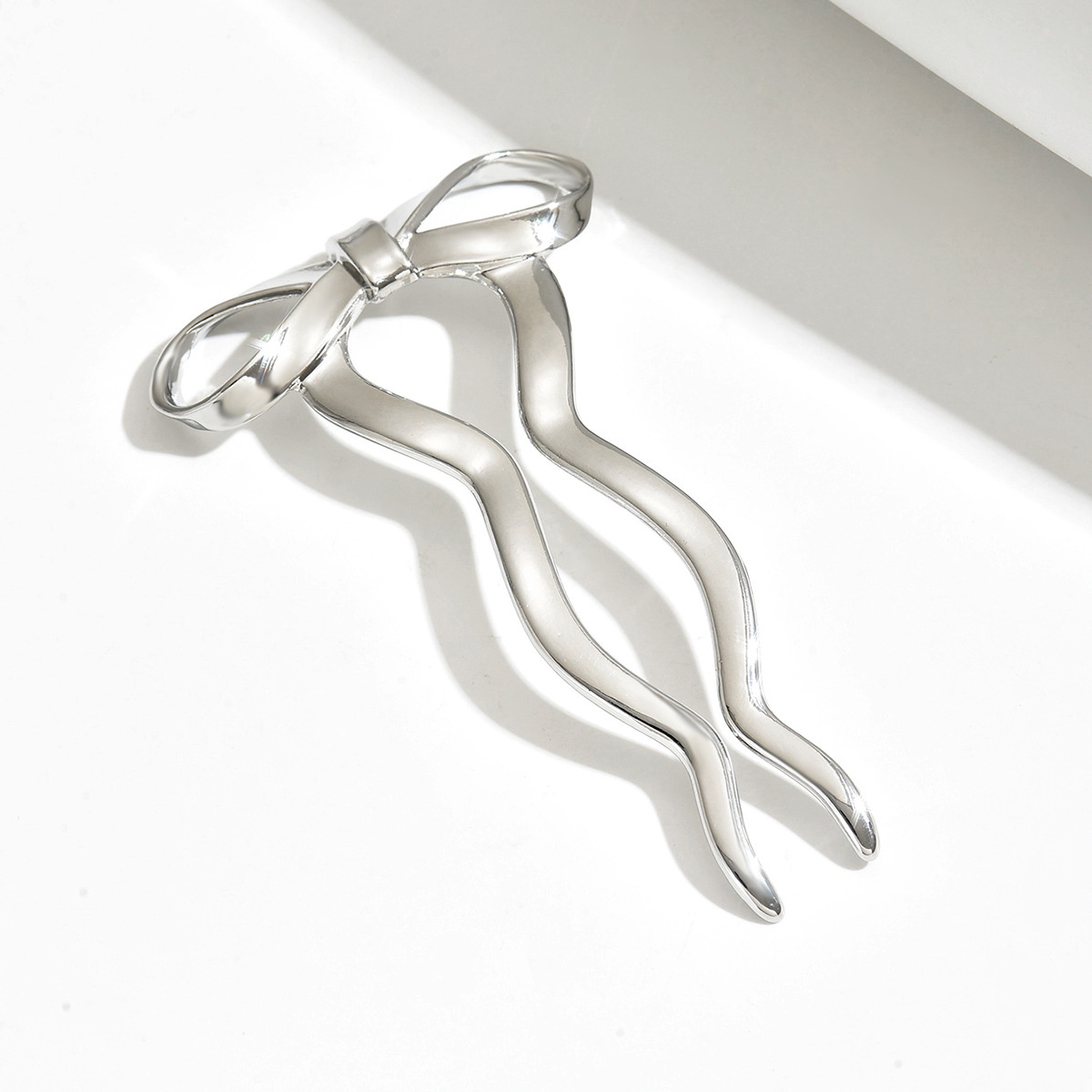 Comercio exterior nuevo clip de cabello de arco mujeres estilo minimalista estilo de alta sensibilidad joyería de cabello 2024 nuevo cabello enrolado joyería