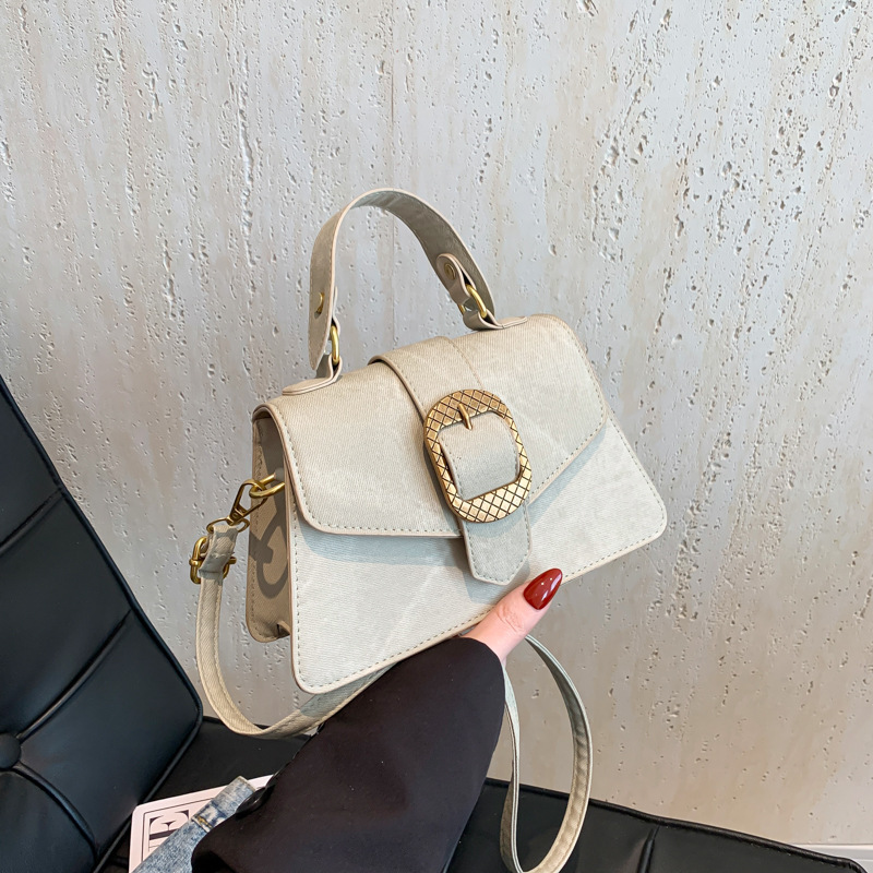Este año popular bolso de brazo 2024 nueva moda francesa hebilla de cinturón decoración de hombro mochila retro bolso de hombro
