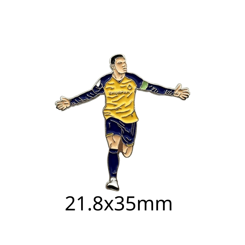 Fabricante personalizado Champions League World Cup Football Super Star Metal Insignia Imagen de dibujos animados Etiqueta del teléfono móvil Insignia Regalo