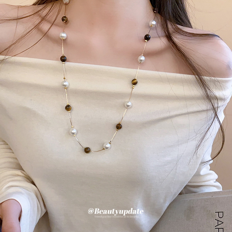 Collar de perlas de piedra de ojo de tigre artificial transfronterizo otoño e invierno cadena de suéter de todo fósforo de nicho accesorios de joyería de moda de alta gama
