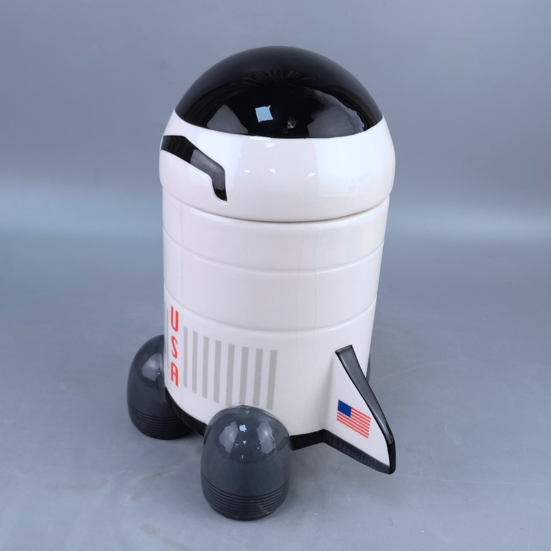 Tanque sellado de cerámica con forma de cohete Nasa Tanque de galletas de gatito de tierra de nube blanca Tanque de almacenamiento de cerámica grande transfronterizo