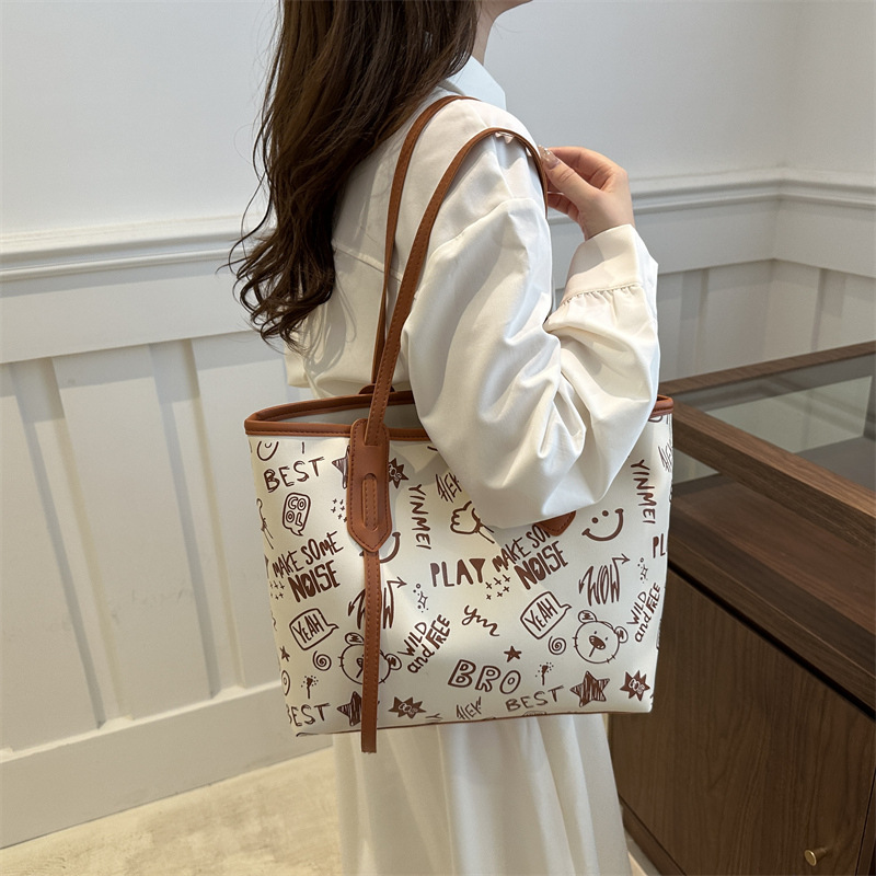 Bolsa de hombro de gran capacidad para mujeres, bolso de alta calidad, bolso grande, 2024 nuevo estilo de moda, bolso de clase de graffiti