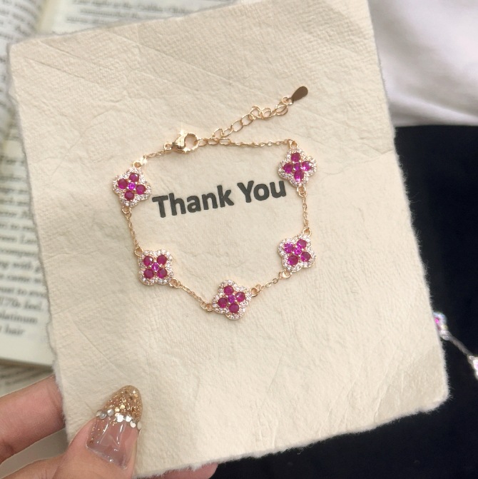 European and American color treasure five-petal four-leaf clover purple zircon flower niche all-match exquisite design sense bracelet women's wholesale generation