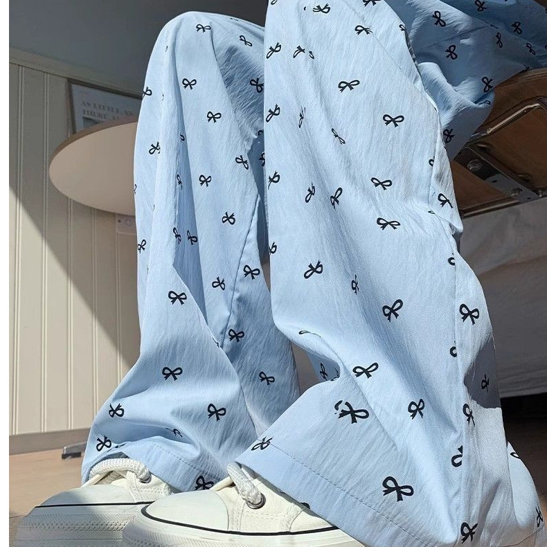 Cuatro estaciones pijamas primavera y otoño dulce delgamiento correa de impresión de arco de verano pantalones largos de invierno pantalones caseros se pueden usar al por mayor