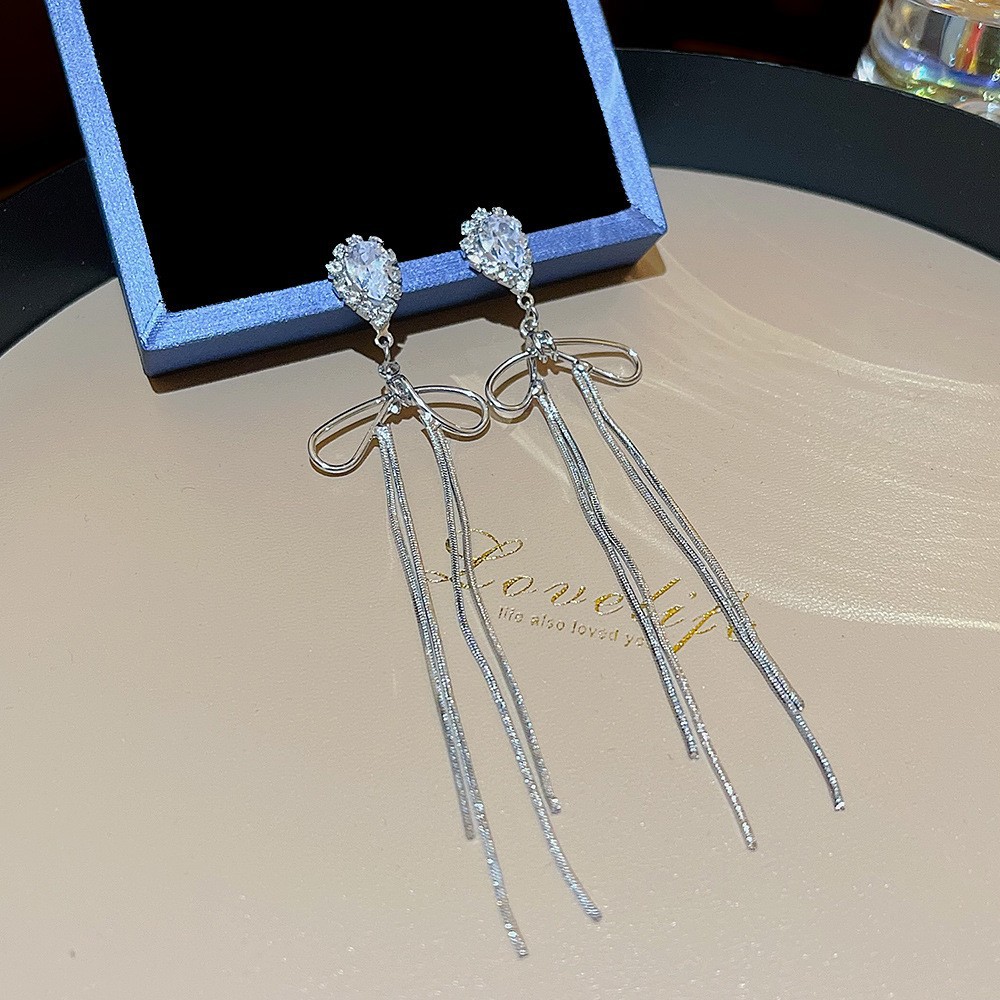 S925 aguja de plata elegante borla pendientes de alta gama simple cara de adelgazamiento pendientes de todo fósforo estilo coreano nuevos pendientes de moda al por mayor